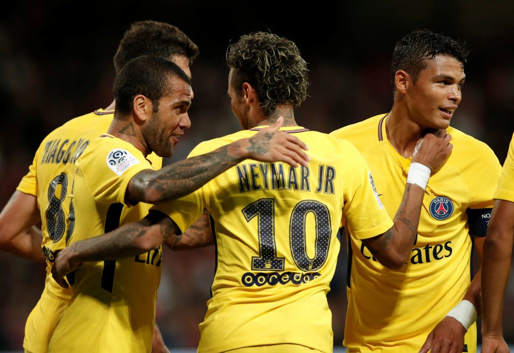 Paris Saint-Germains Neymar celebrates with Dani Alves and Thiago Silva.