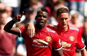 Paul Pogba celebrates with Nemanja Matic.