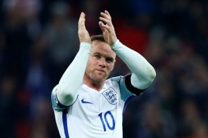 ngland's Wayne Rooney applauds fans after the game.