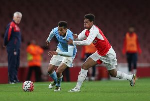 Arsenal's Marcus McGuane and Manchester City's Lukas Nmecha in action.