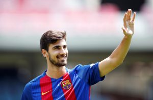 FC Barcelona's Andre Gomes waves to the crowd.