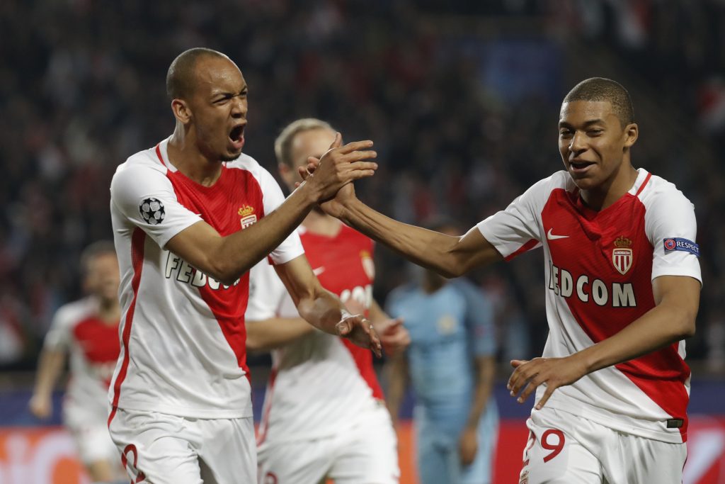 Monaco's Fabinho celebrates with Kylian Mbappe-Lottin.