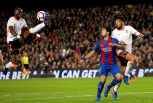 Eliaquim Mangala in action next to Luis Suarez and Ezequiel Garay.