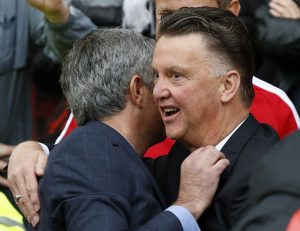 Louis van Gaal (R) greets Jose Mourinho.