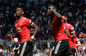 Manchester United's Eric Bailly celebrates scoring their first goal with Romelu Lukaku and Paul Pogba.