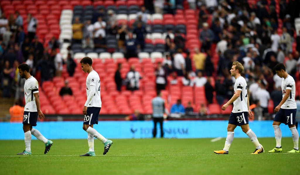 Tottenham's Dele Alli (2nd L) and team mates look dejected after the match.