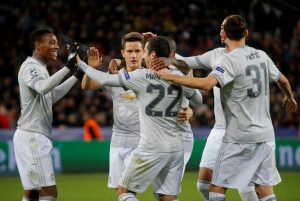 Henrikh Mkhitaryan celebrates scoring their fourth goal with Anthony Martial, Nemanja Matic and team mates.