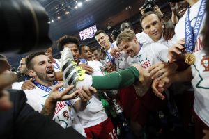 Portugal's Adrien Silva celebrates with team mates after winning Euro 2016.