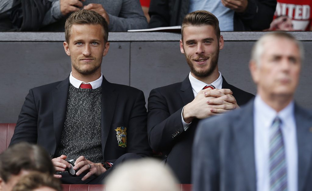Anders Lindegaard and David de Gea watch from the stands.