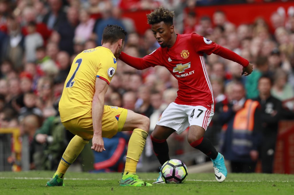 Manchester United's Angel Gomes in action with Crystal Palace's Joel Ward.