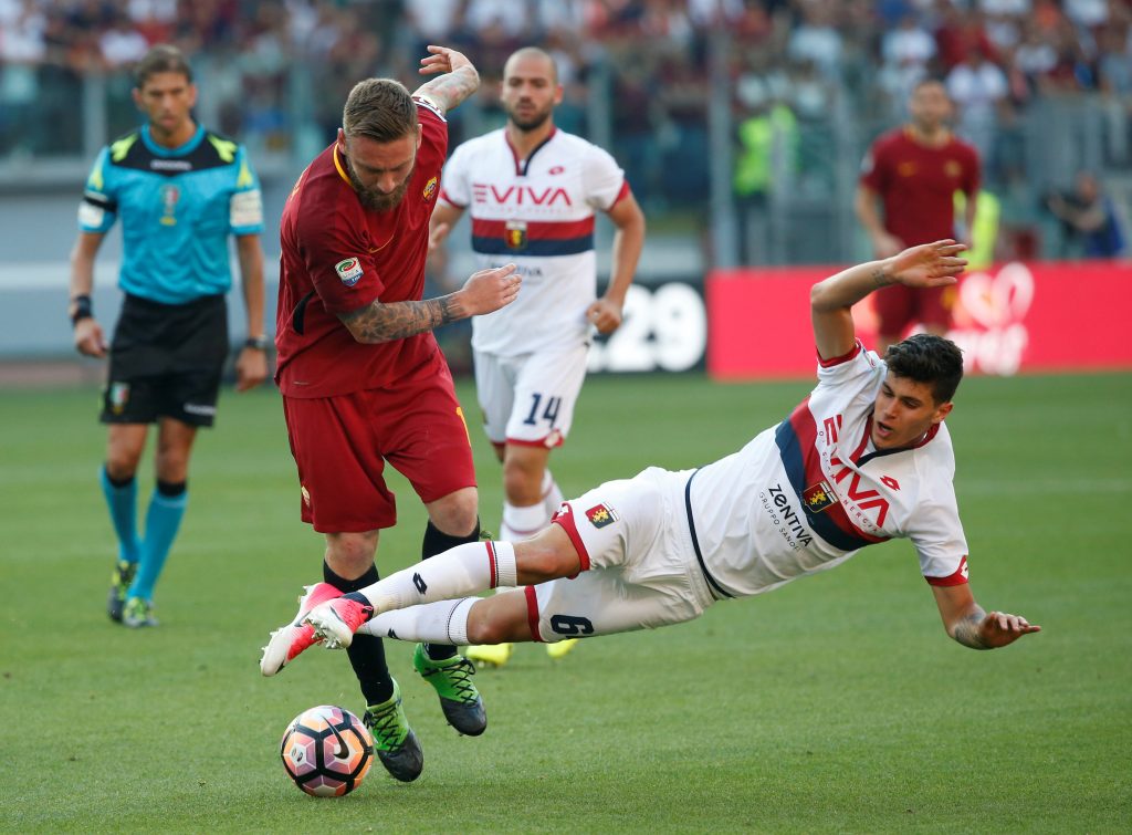 Romas Daniele De Rossi in action with Genoas Pietro Pellegri.