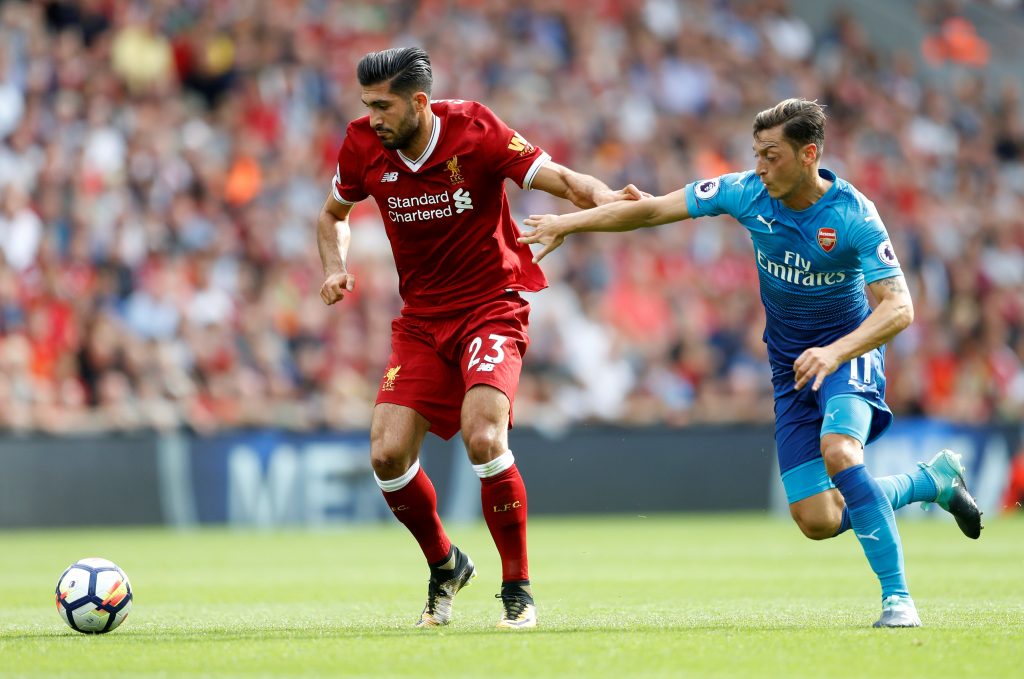 Liverpool's Emre Can in action with Arsenal's Mesut Ozil.