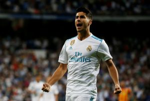Real Madrids Marco Asensio celebrates.