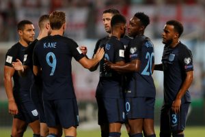 Englands Ryan Bertrand (R) celebrates scoring their second goal with team mates.