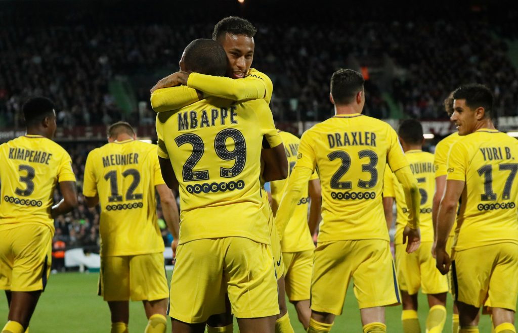 Paris Saint-Germains Neymar celebrates scoring their third goal with Kylian Mbappe.