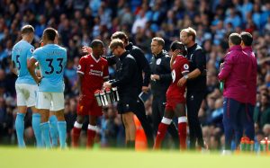 Liverpool's Sadio Mane is hugged by manager Jurgen Klopp as he walks off dejected after being sent off.