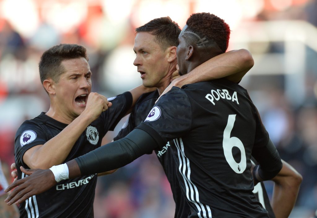 Paul Pogba celebrates with Nemanja Matic and Ander Herrera.