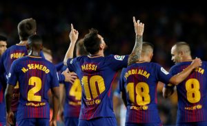 Barcelonas Lionel Messi celebrates scoring their first goal.