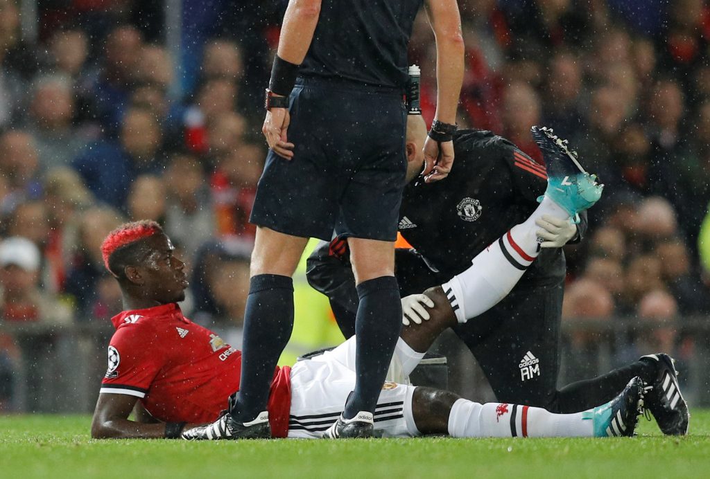 Paul Pogba receives medical attention after sustaining an injury