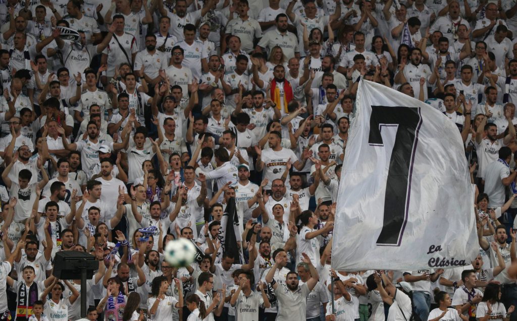 Real Madrid fans wave a flag in reference to Cristiano Ronaldo.
