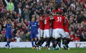 Manchester United's Antonio Valencia celebrates scoring their first goal with team mates.