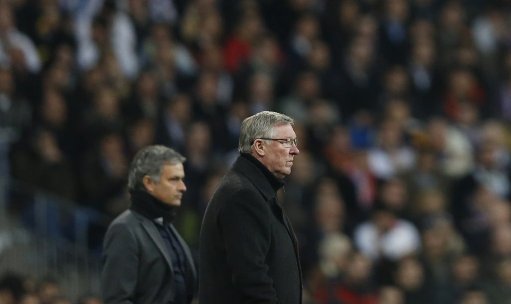 Alex Ferguson (R) and Jose Mourinho watch the Champions League soccer match at Santiago Bernabeu stadium.