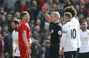 Steven Gerrard is shown a red card by referee Martin Atkinson.