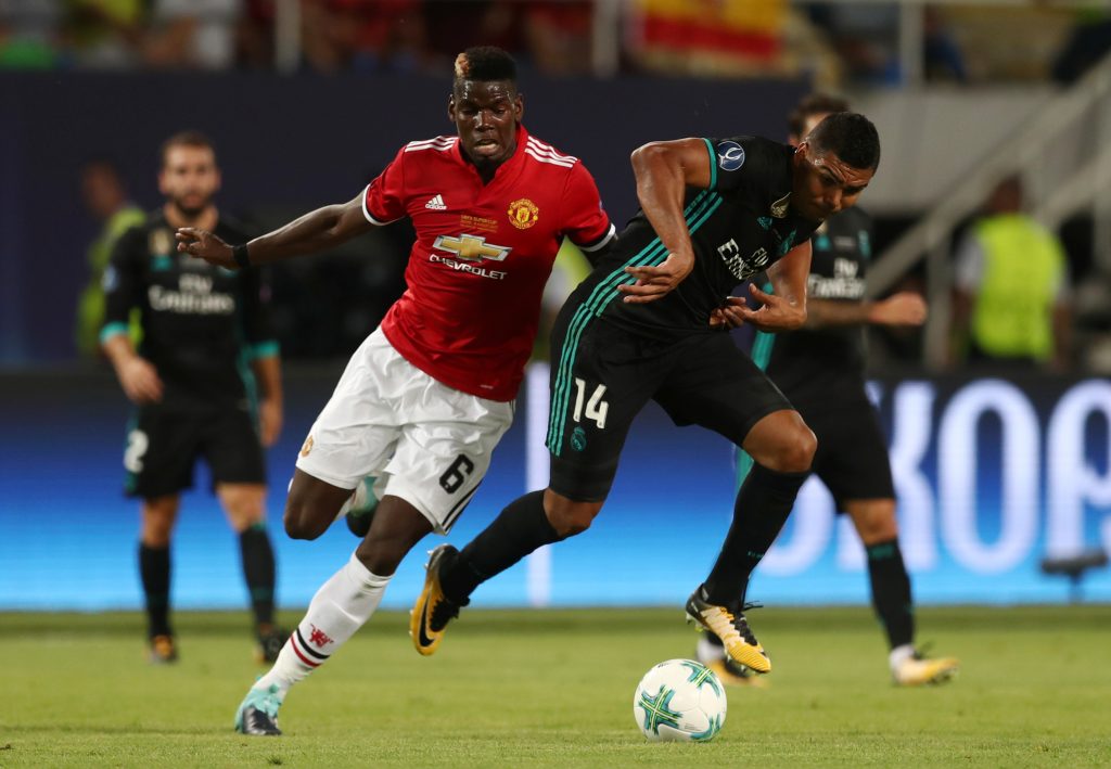 Real Madrids Casemiro in action with Manchester United's Paul Pogba.