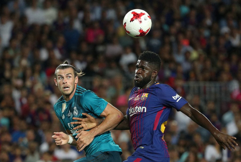 Barcelonas Samuel Umtiti in action with Real Madrids Gareth Bale.