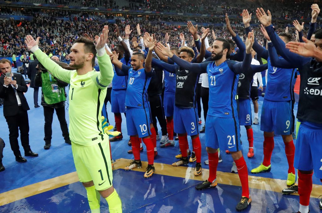 France's Hugo Lloris and team mates celebrate their qualification for the World Cup.