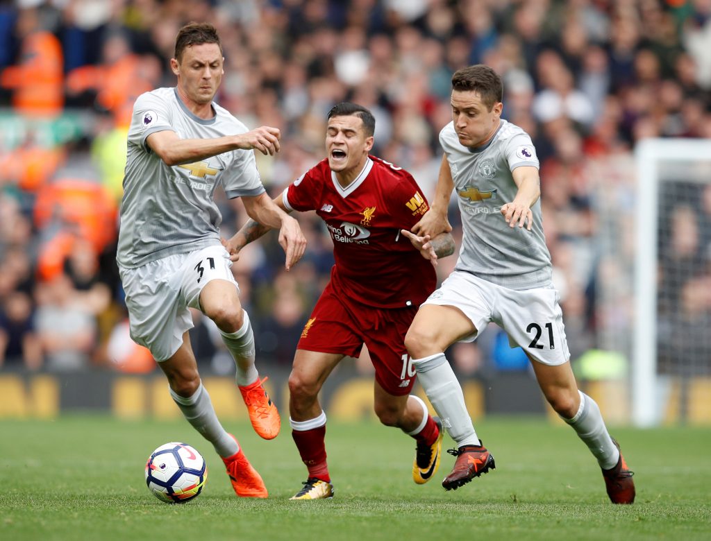 Philippe Coutinho in action with Nemanja Matic and Ander Herrera.