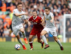 Philippe Coutinho in action with Nemanja Matic and Ander Herrera.