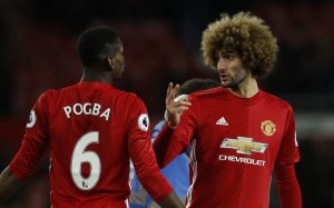 Manchester United's Paul Pogba and Marouane Fellaini celebrates after the game.