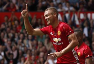 Manchester United '08 XI's Nemanja Vidic celebrates scoring their first goal.