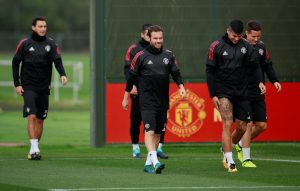 Juan Mata, Marcos Rojo and Ander Herrera during training.