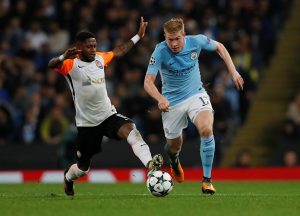 Manchester City's Kevin De Bruyne in action with Shakhtar Donetsk's Fred.
