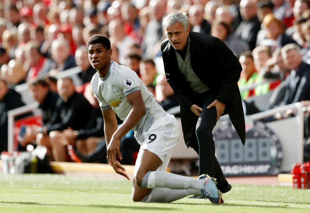 Jose Mourinho reacts as Marcus Rashford looks on.