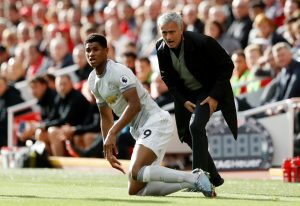 Jose Mourinho reacts as Marcus Rashford looks on.