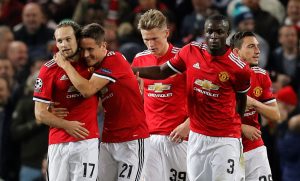Daley Blind celebrates with Ander Herrera and Eric Bailly after scoring from the penalty spot.
