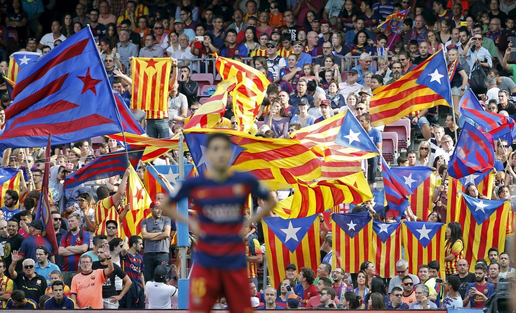 Fans wave "Estelada" flags, a symbol of Catalonian pro-independence, during a Spanish first division soccer match.