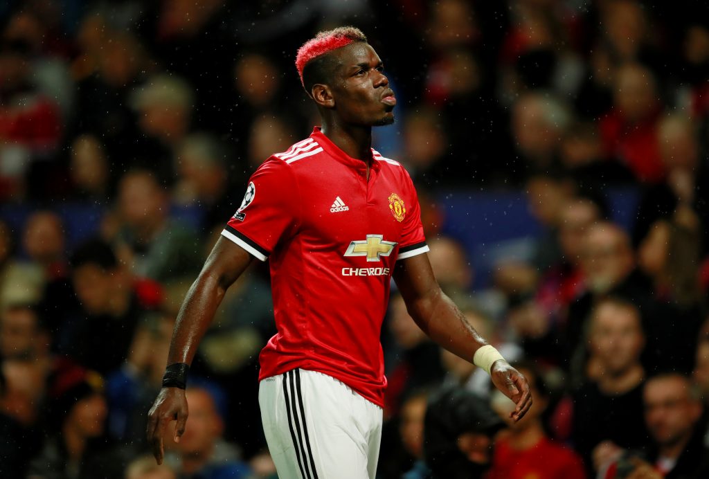 Paul Pogba walks off as he is substituted for Marouane Fellaini after sustaining an injury.
