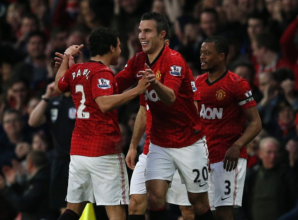 Manchester United's Robin Van Persie (C) celebrates his second goal against Aston Villa with Rafael (L) and Patrice Evra.