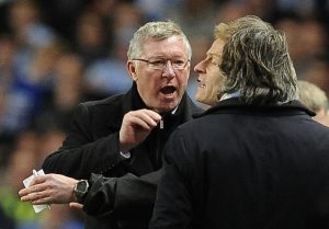 Alex Ferguson (L) gestures towards Roberto Mancini (R) during their soccer match at the Etihad stadium in Manchester, northern England April 30, 2012.
