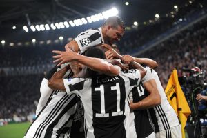 Juventus Gonzalo Higuain celebrates with team mates after scoring their second goal.