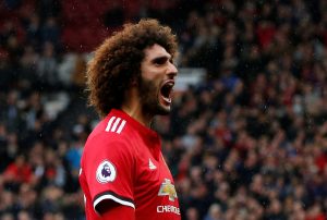 Marouane Fellaini celebrates scoring.