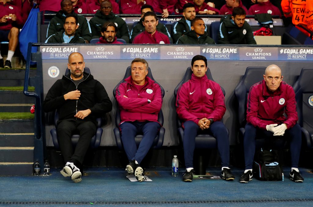 Pep Guardiola and coach Mikel Arteta (2nd R).