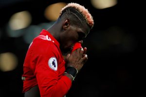 Manchester United's Paul Pogba walks off at half time.