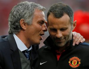Ryan Giggs (R) listens to Jose Mourinho.