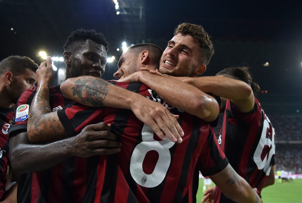 AC Milan's Suso celebrates scoring their second goal with teammates.