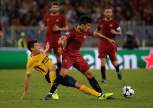 AS Roma's Diego Perotti in action with Atletico Madrid's Nicolas Gaitan.